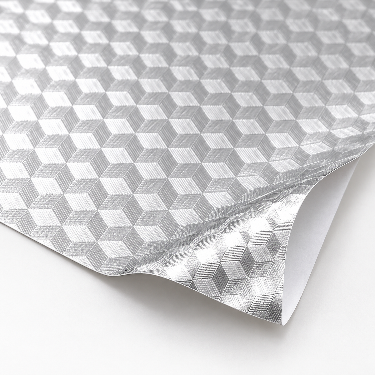 Silver embossed geometric texture and white release backing