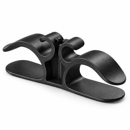 Black appliance cord organizer, right three-quarter view on white background