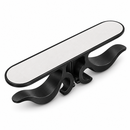 Black appliance cord organizer, upside-down view showing adhesive liner on underside of base